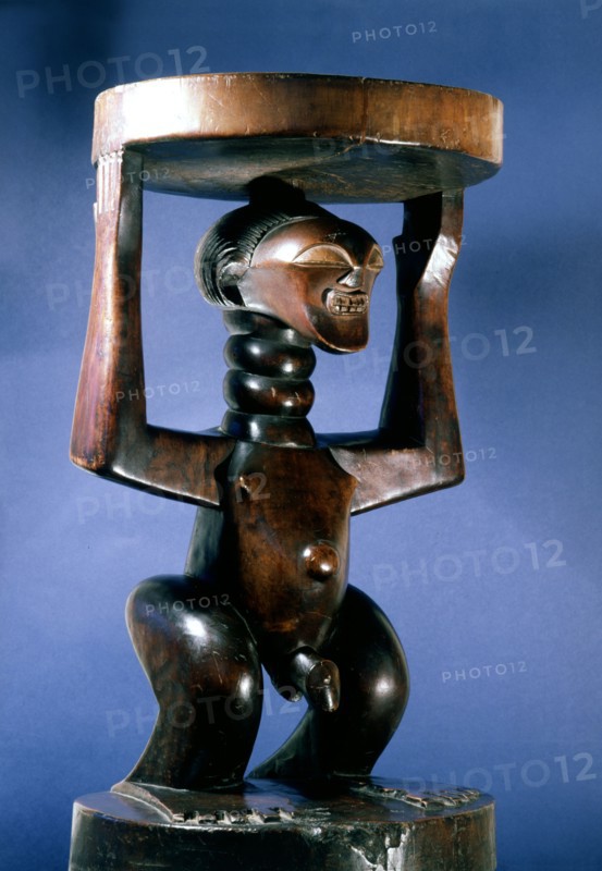Stool supported by a male figure, served as an emblem of status and prestige for Songye chiefs