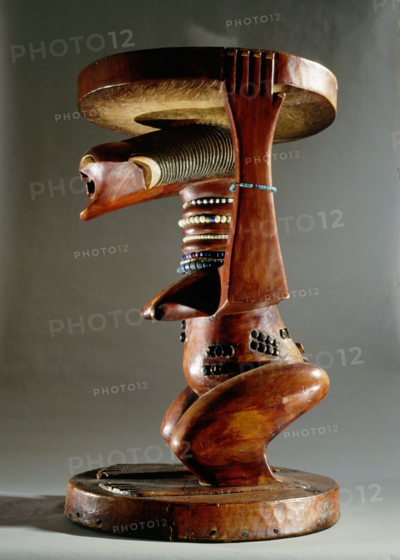 Stool supported by a female figure, served as an emblem of status and prestige for Songye chiefs