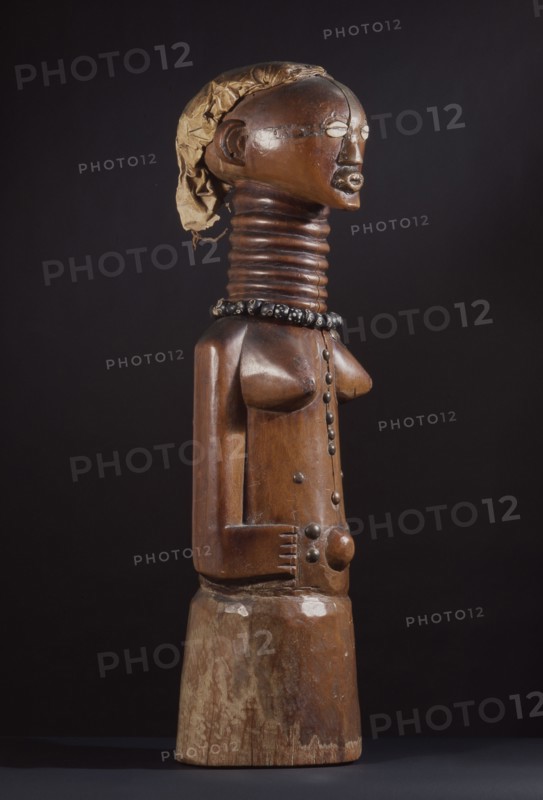 Minkishi, Songye power figure obtained from a doctor/diviner and used by its owner to heal, to promote fertility or to attack enemies using attached medicines wrapped around the base