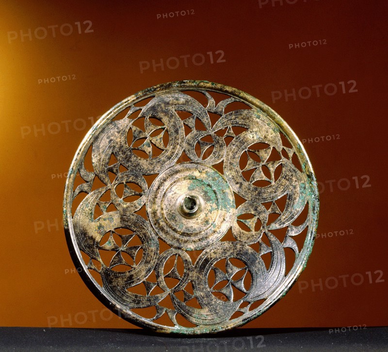 Circular harness plaque in bronze openwork