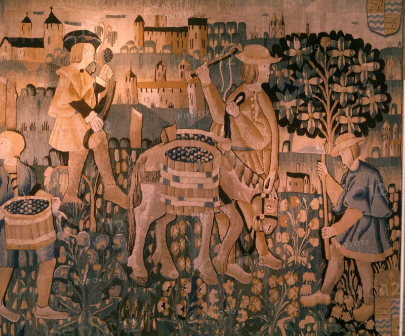 A detail of a tapestry depicting work in the vineyards