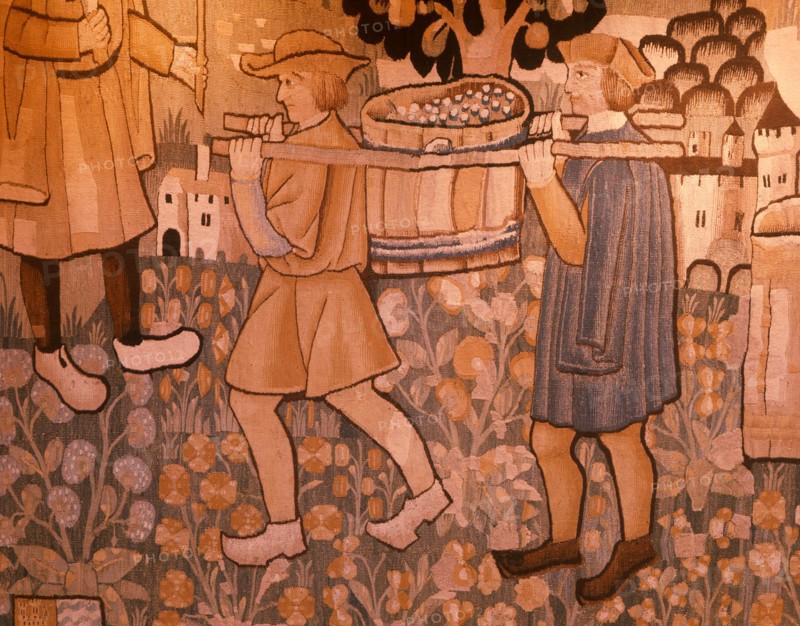 A detail of a tapestry depicting work in the vineyards