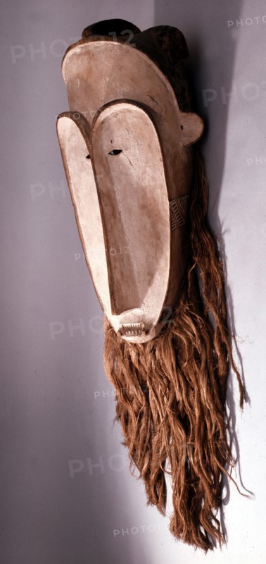 Masks with elongated white faces of this type were used by men of the Fang judiciary association known as Ngil