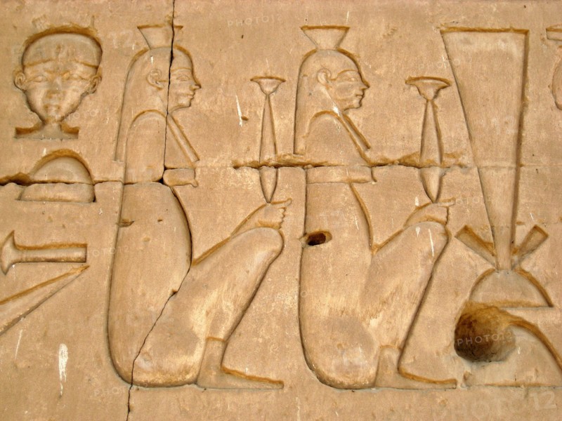 Women holding incense jars on the eastern outside wall of the Sanctuary of Horus