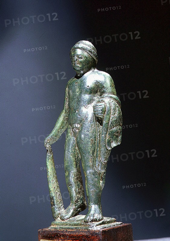 Bronze figure of Heracles, holding the Nemean lion skin over his left arm and a club in his right hand