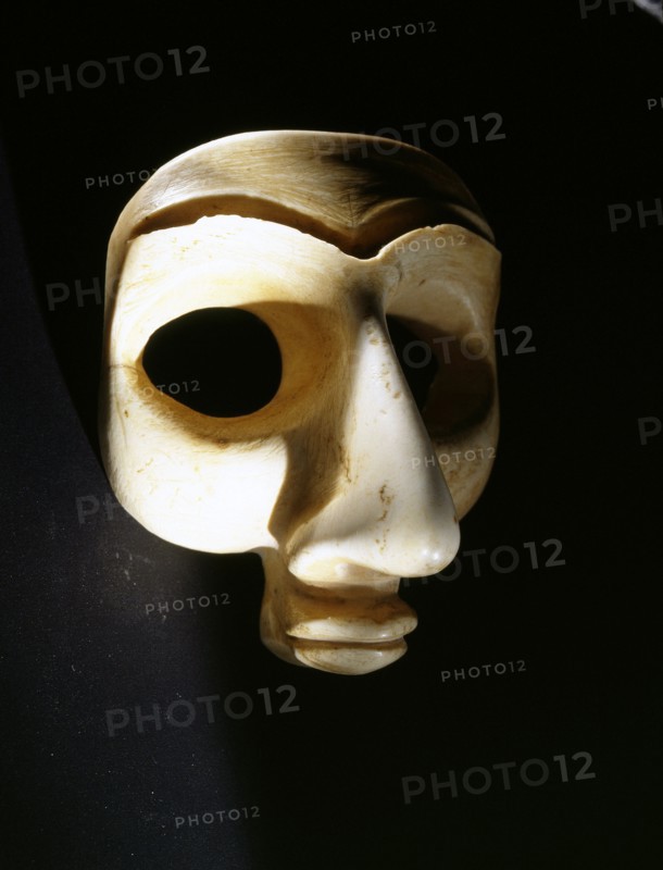 Head, probably from a bearded male votive statuette, with large eye recesses for inlay