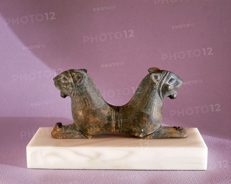 A double headed lion reclining