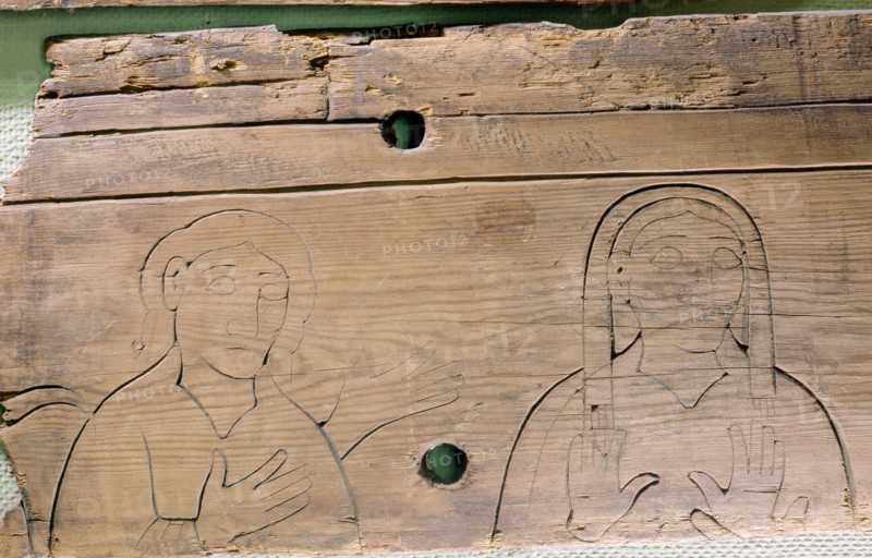 One of the Flatatunga softwood panels incised with a design depicting saints