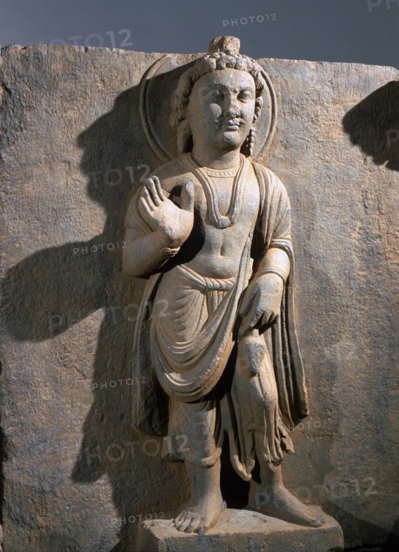 Frieze with depiction of the Reassuring Maitreya flanked by two donors