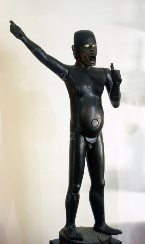 A life size guardian figure   possibly from a graveyard   meant to ward off evil spirits