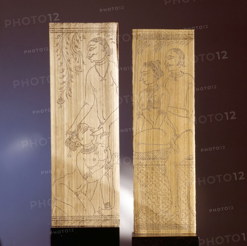 Two leaves of a palm leaf manuscript depicting erotic scenes