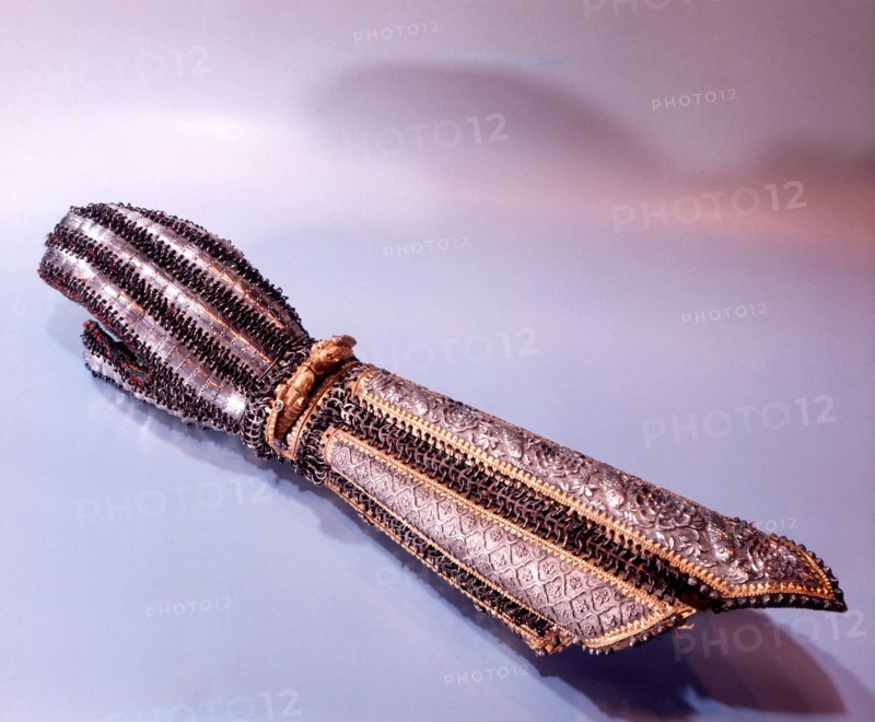 A gauntlet of a Rajasthani prince which is adorned with a gold bracelet in the form of two dragons with eyes of ruby and sapphire