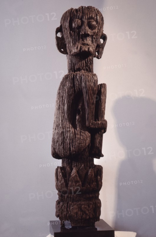 A male figure rising from a tree