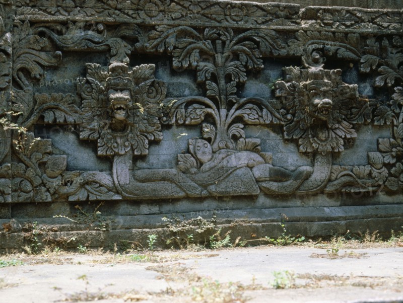 Stone relief on a temple wall at Sangsit, Buleleng