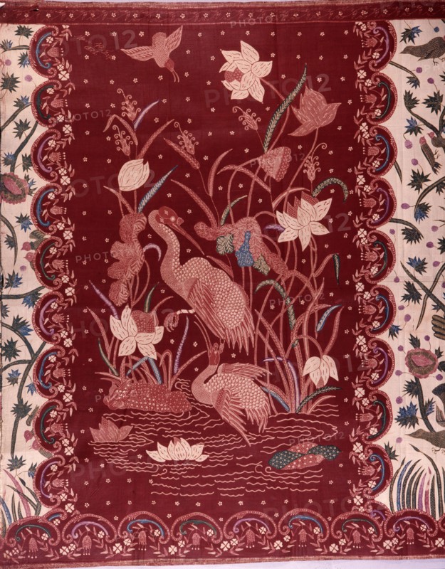 A detail of the design on a batik sarong which incorporates herons and other birds, flowers and water plants