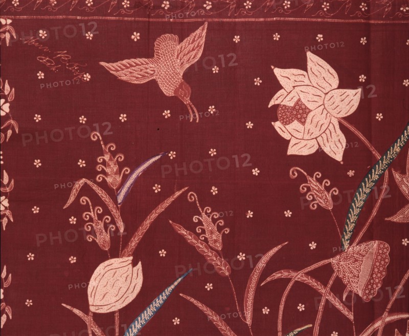 A detail of the design on a batik sarong which incorporates herons and other birds, flowers and water plants