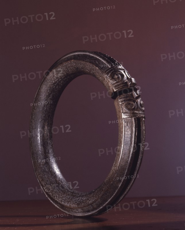 A bracelet decorated with a design of a dragons head