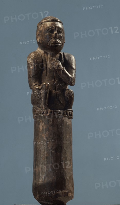 A stopper in the form of a Chinese or Malay man