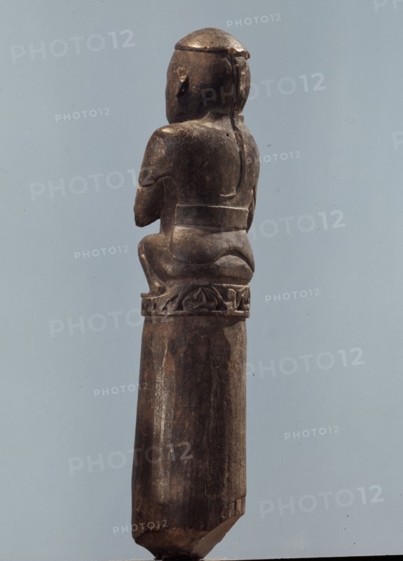 A stopper in the form of a Chinese or Malay man