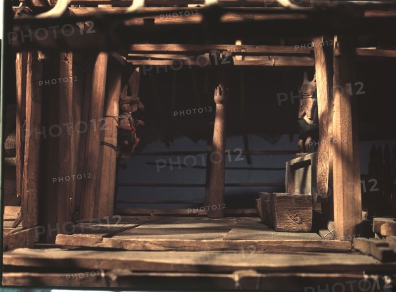 Model of a Nias spirit or ghost house, which ancestral spirits, represented by the carved figures, were expected to inhabit