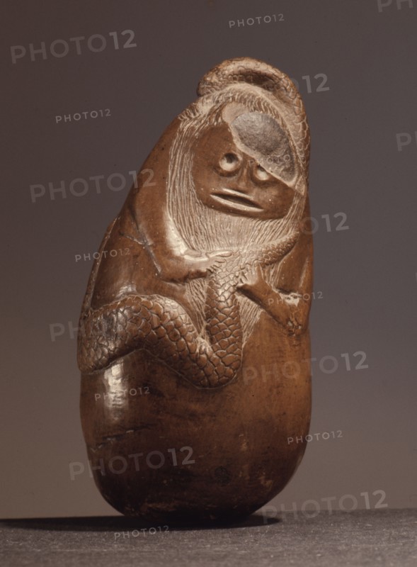 An ancient Indonesian cult object, thought to be a snake god or demon