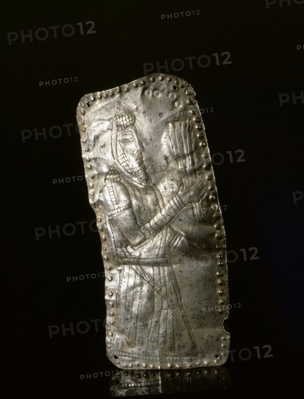 Silver repousse plaque depicting a male figure