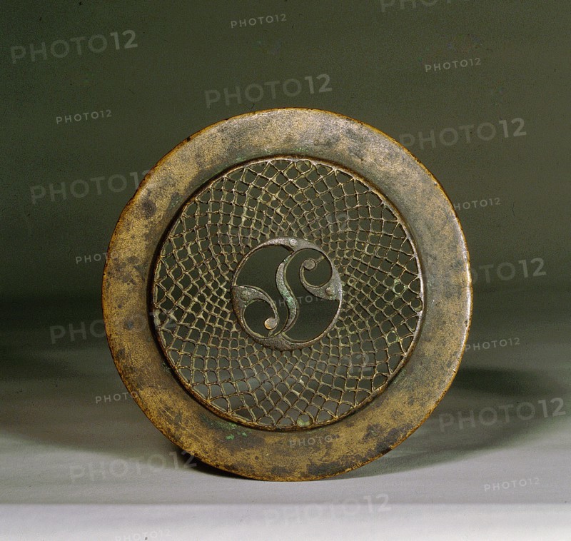 Openwork bronze ornament, function remains unknown