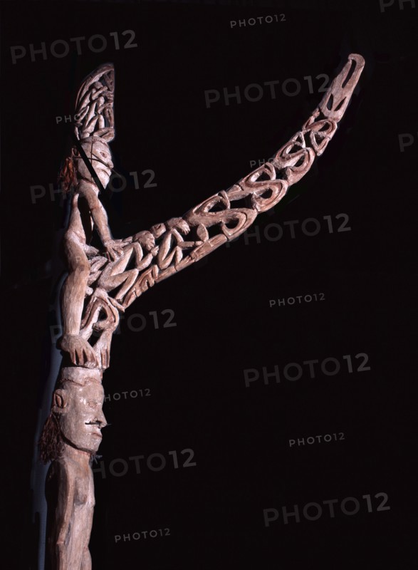 Phallic figures surmounting Asmat pole sculptures known as bis poles