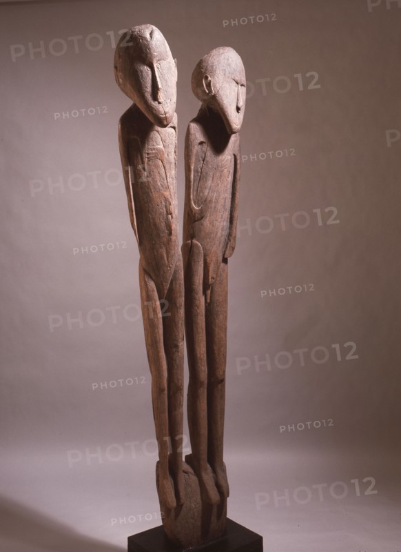 A carving depicting paired male and female clan ancestors, from a Lake Sentani mens meeting house