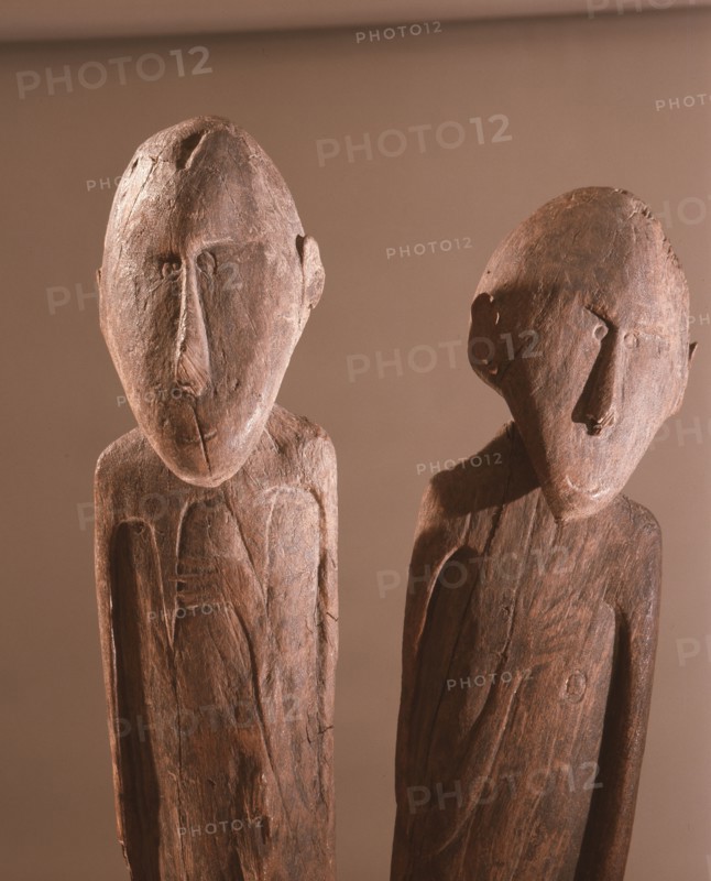 A carving depicting paired male and female clan ancestors, from a Lake Sentani mens meeting house