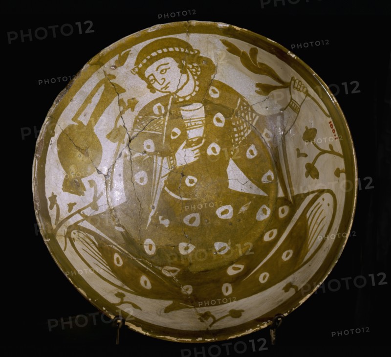 Pottery fragment with depiction of a young courtier holding a glass and a branch, with a ewer at his right