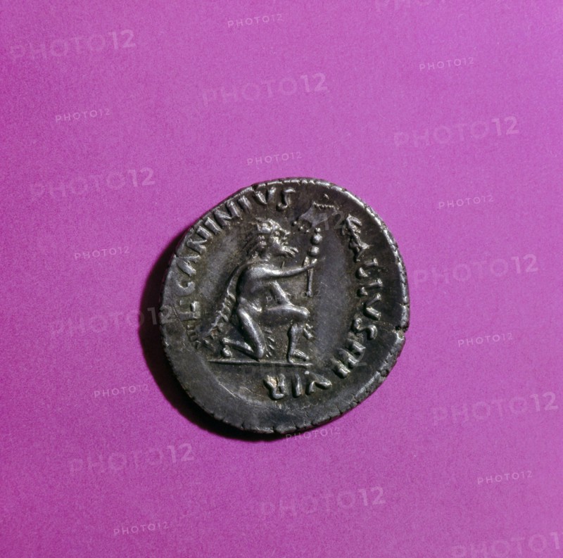 Coin of Augustus depicting a kneeling German surrendering a standard