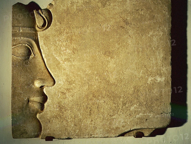 Fragment of a relief showing the profile of an Egyptian king wearing the uraeus