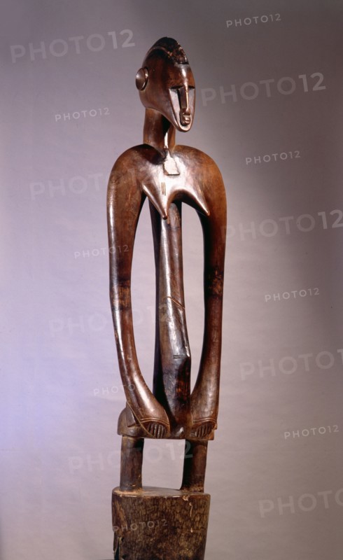 A fine example of a deble, or rhythm pounder, used to beat time for dances held in the sacred grove of the mens society in ceremonies such as funerals