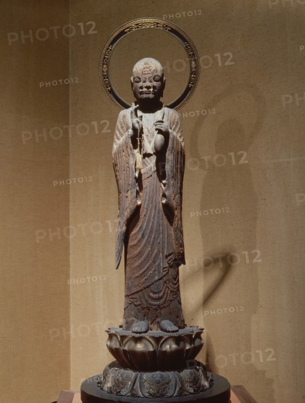 The priest Hoshi, reputed to be the incarnation of a deity, the face of which is emerging from that of the priest in this sculpture