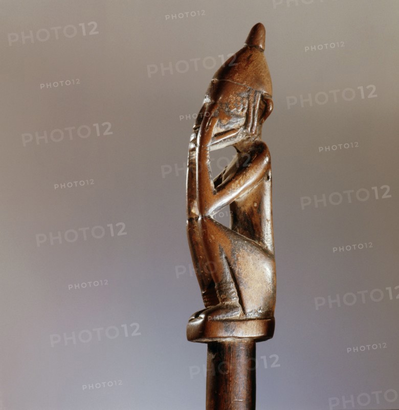 A divination tapper in the form of a miniature nommo figure in the so called shame position