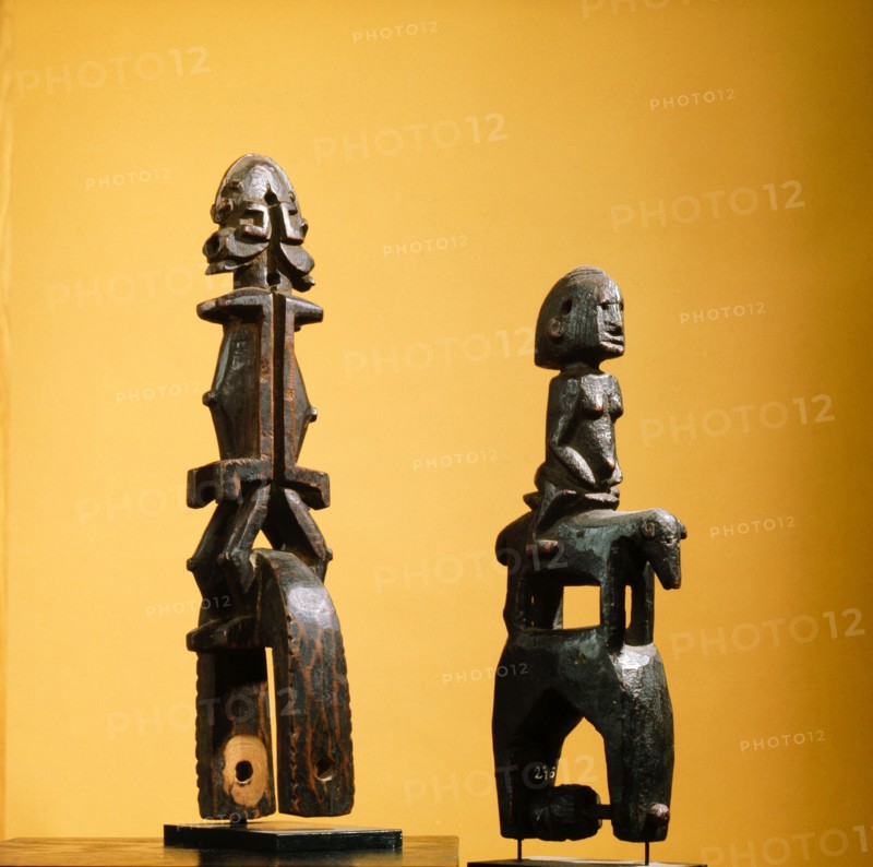 Heddle pulley used to support the cord to the foot pedals which alternate the heddles on the narrow strip loom typical of West African mens weaving