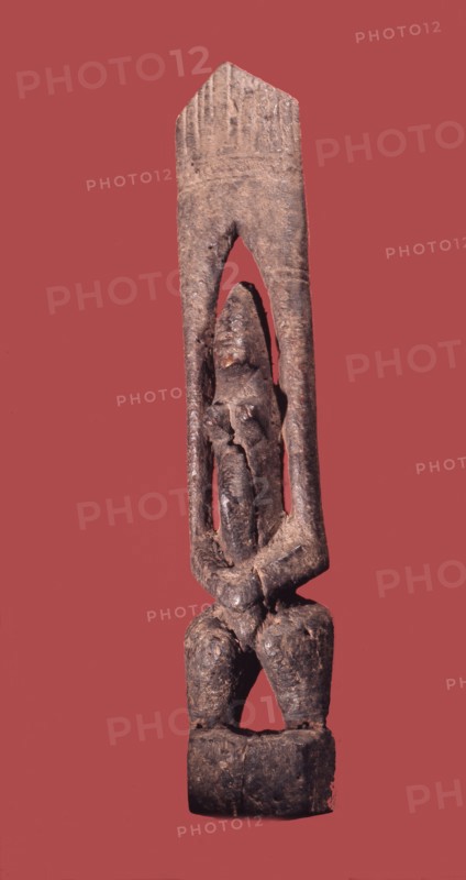A wood sculpture of a nommo figure, the offspring of the Dogon creator god, Amma and his Earth wife