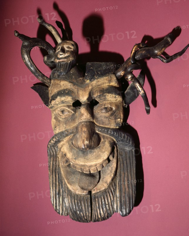Mask of a horned, bearded devil, worn during dances to pacify evil spirits