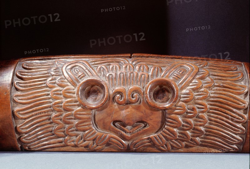 A teponaztli or two toned drum with a horned owl carved on the side