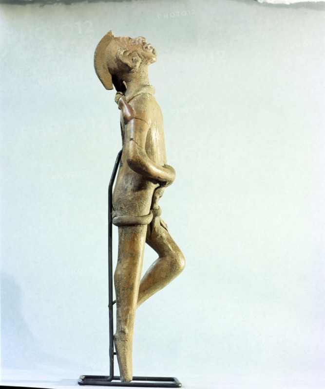 Figurine of a man singing and dancing at a festival
