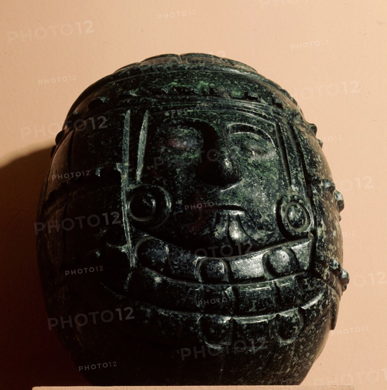 Green stone carving of a deity