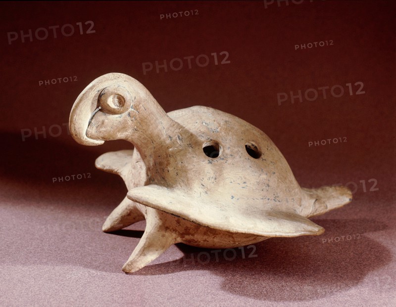 Ceramic flute of the kind known as ocarina in the shape of a macaw or parrot