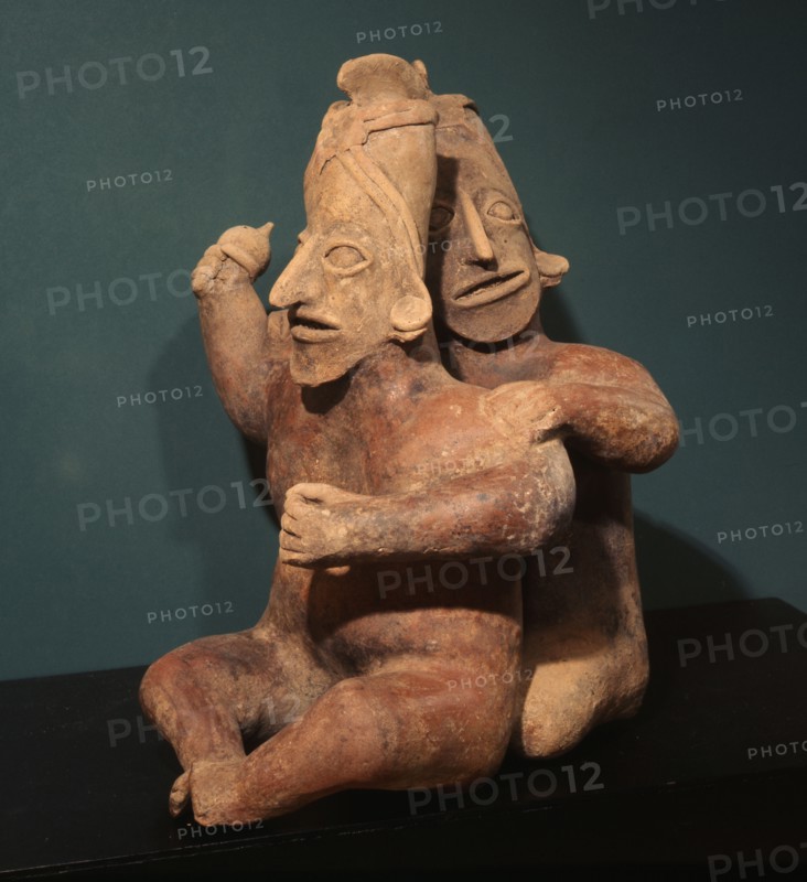 Two seated figures