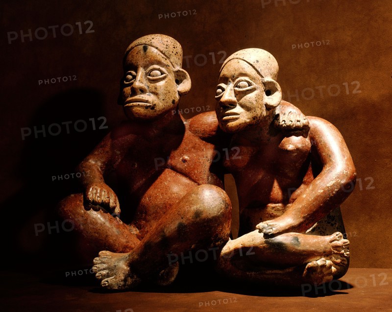 Seated figures of an embracing couple