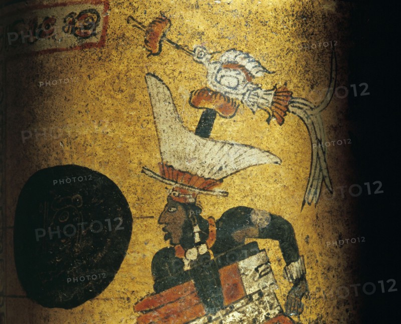 Cylindrical vessel decorated a Mayan ball player wearing black body paint and heavy padding for the competition