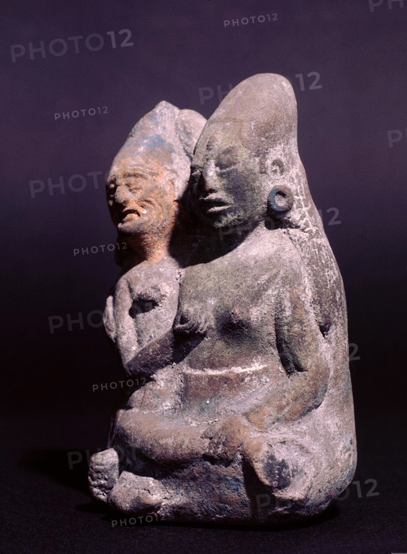 Two figures, an old man and a young woman, possibly representing the sun and the moon