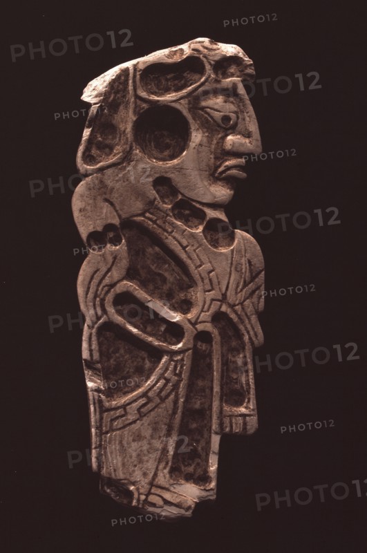 Polished stone relief carving of a Mayan dignitary