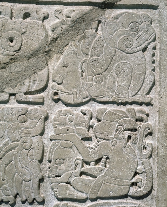 Lintel with glyphs carved in relief to represent a single date
