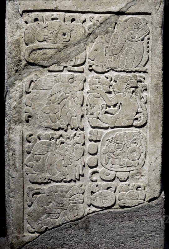 Lintel with glyphs carved in relief to represent a single date